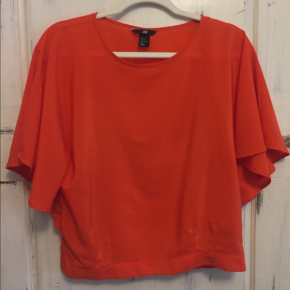 H&M orange colored blouse. Full sleeves. Size 4